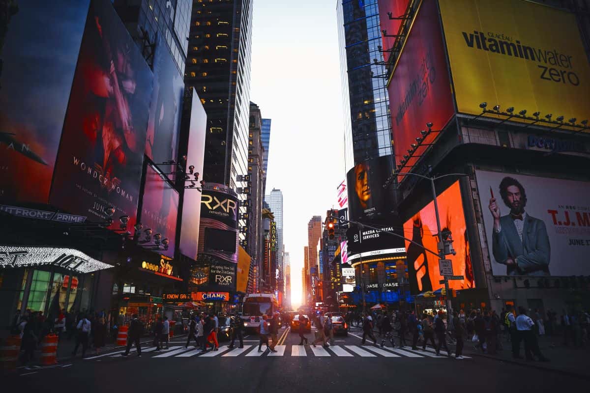Times Square in New York City with billboards and yellow taxis